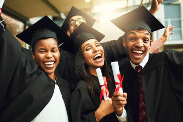 Students celebrating graduating